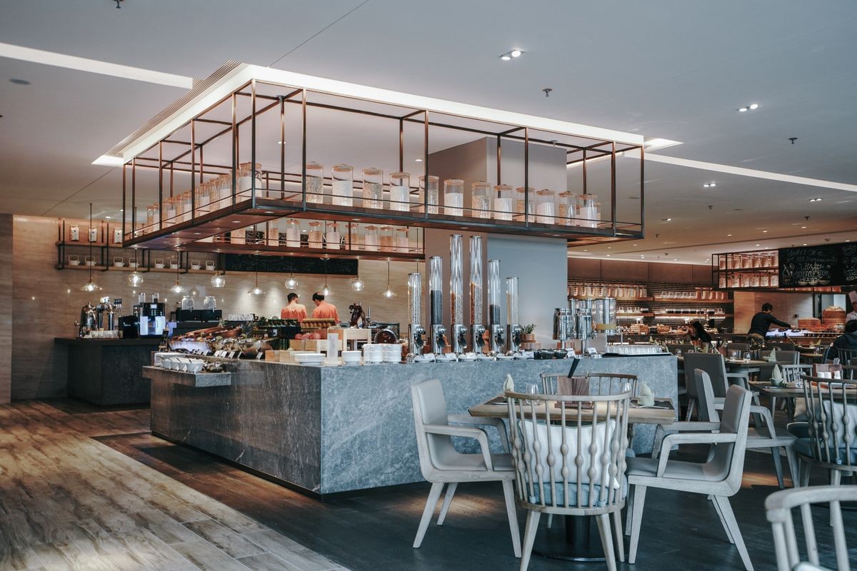 Restaurant interior, part of hotel, fresh and simple design style.